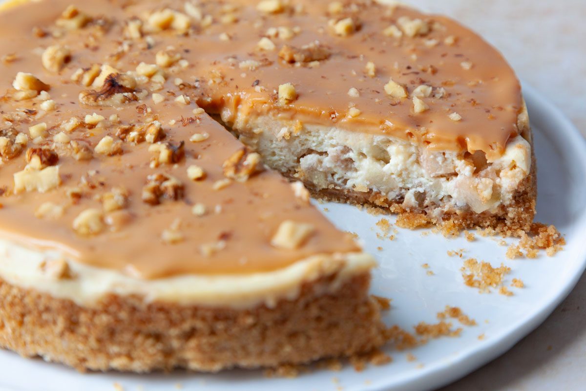 Close up of full yield of Taste of Home Caramel Apple Cheesecake with a slice out