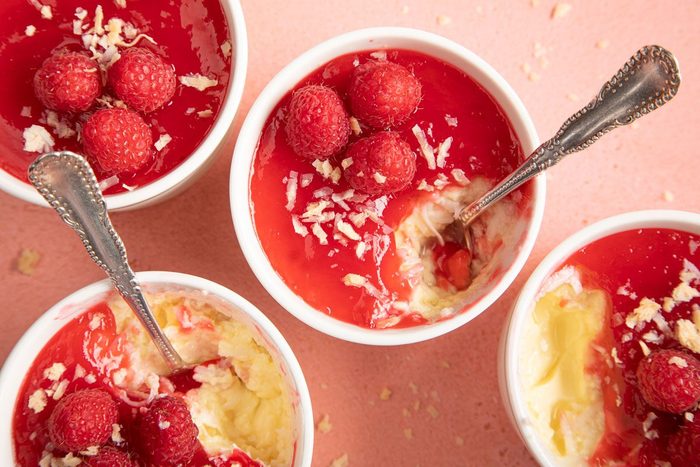 Coconut Custard topped with raspberry in small ramekin dishes