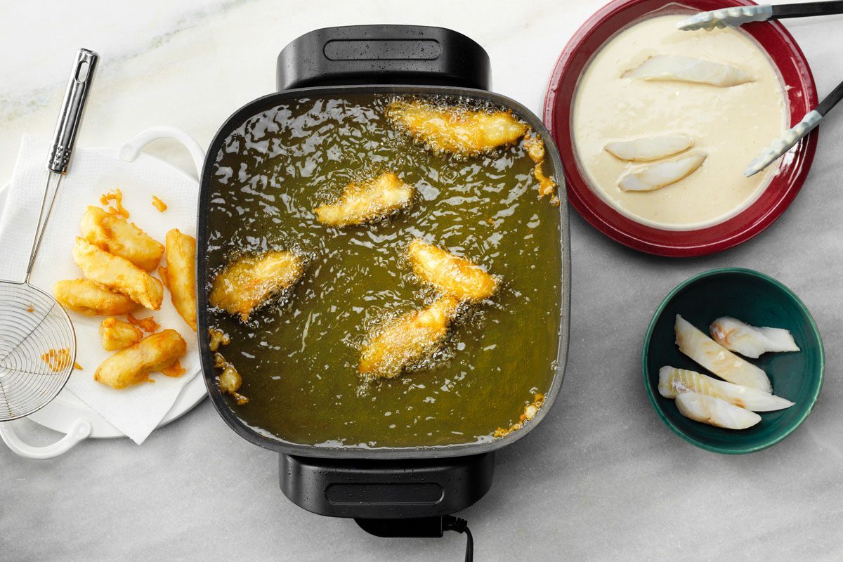 frying fish to make Beer Battered Fish Tacos