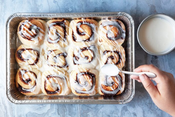 Step 6 of Taste of Home Amish Cinnamon Rolls is to combine the icing ingredients in a mixing bowl, beating them until they come together to form a smooth icing and then drizzle the icing over the cinnamon rolls.