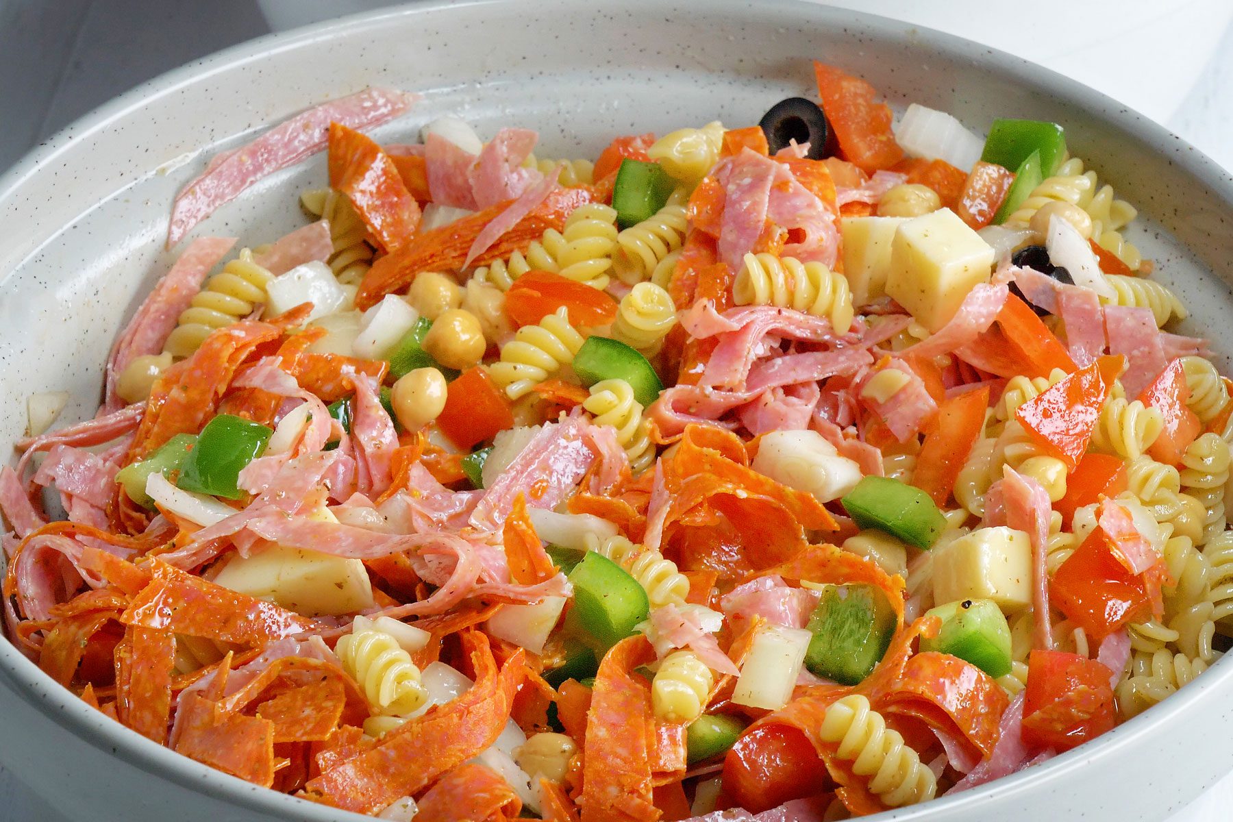 Vinegar, sugar, oregano, salt and pepper dressing poured over pasta.