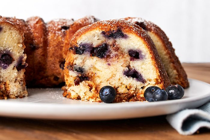 Blueberry Coffee Cake Hero, straight on close up shot of cake sliced into
