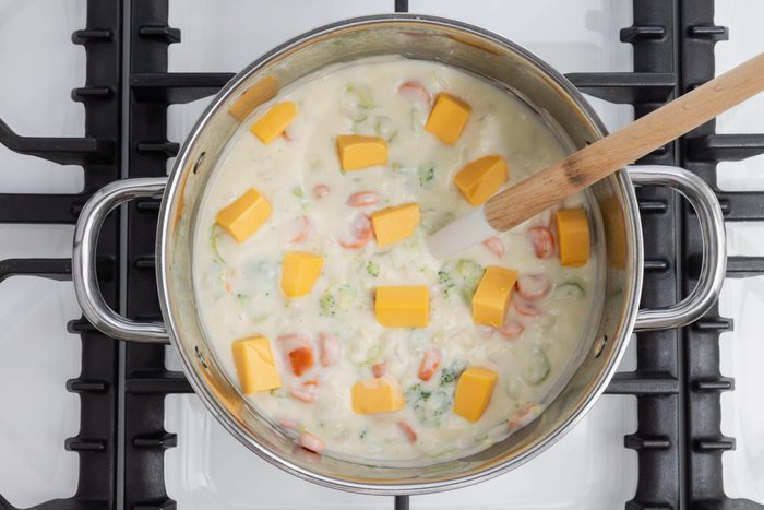 Velveeta being added to the soup.