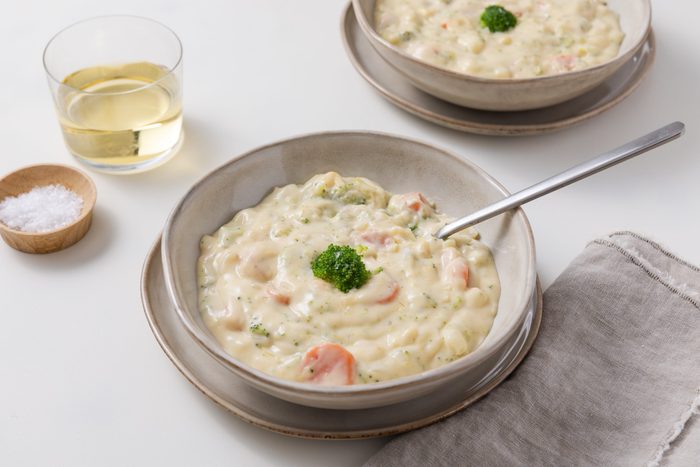 Broccoli cheese soup served in bowls.