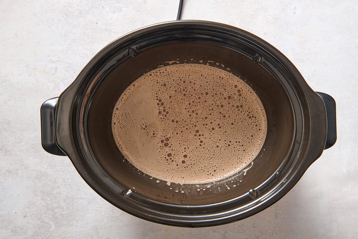 Caramel mocha mixture being warmed in a slow cooker