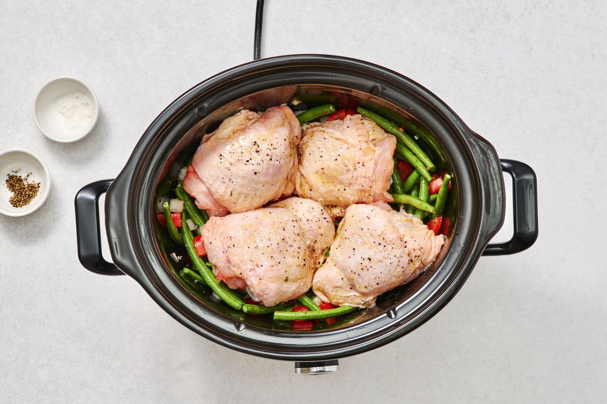 Adding the chicken to slow cooker