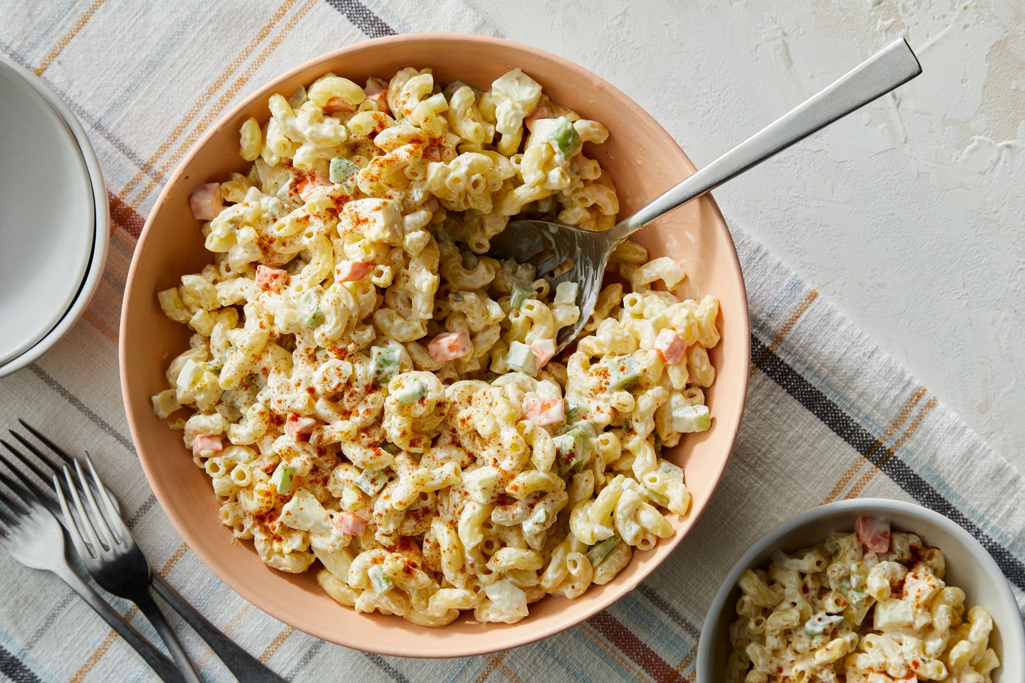 Macaroni Salad Recipe served in bowls with fork
