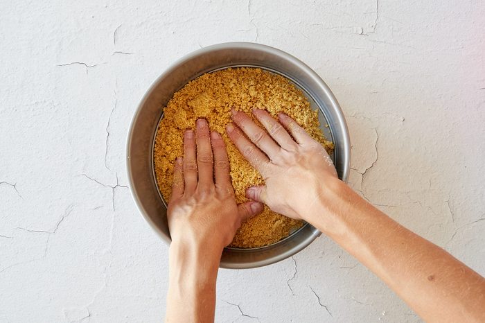 Make the crust for easy cheesecake.