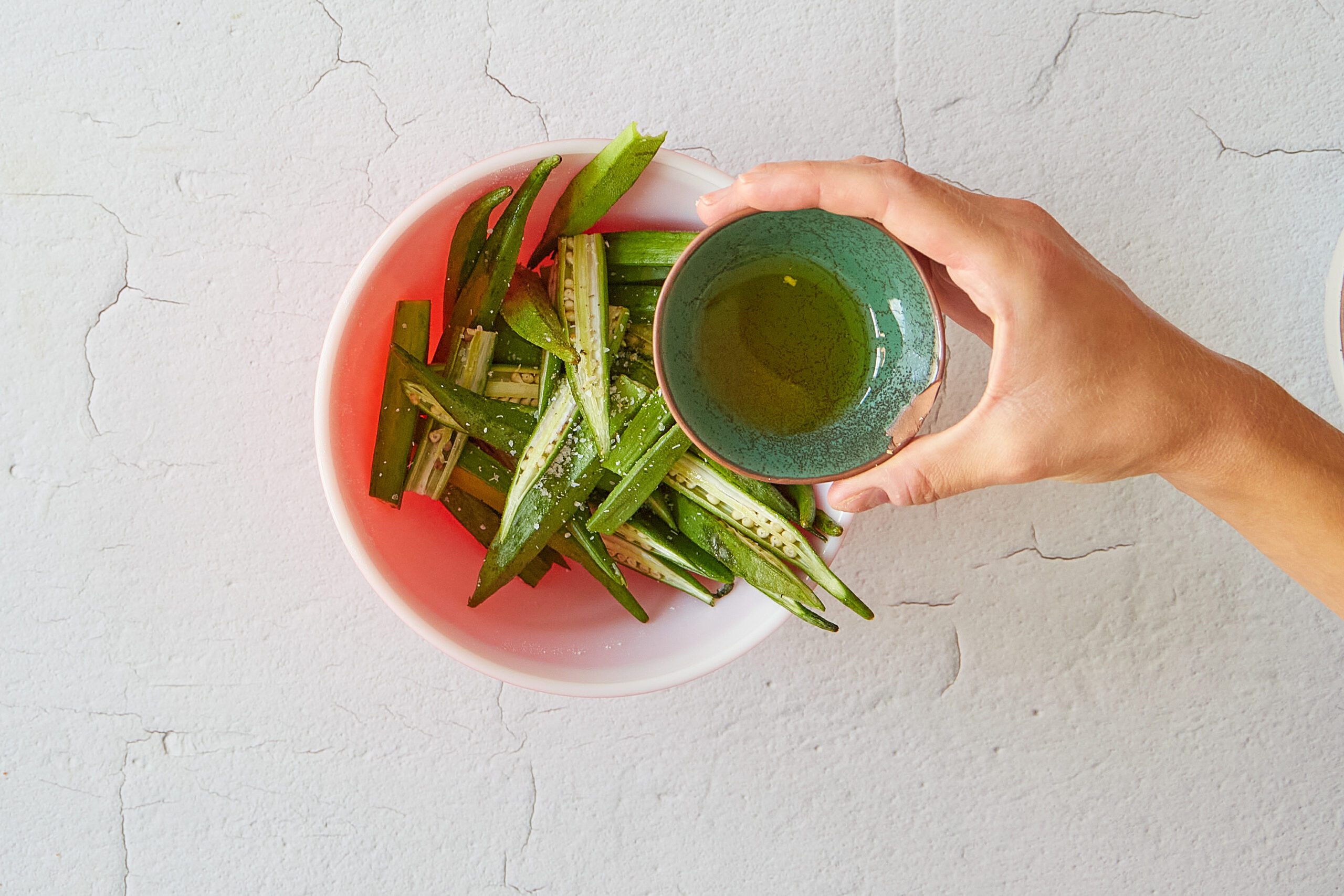Season the okra to roast.