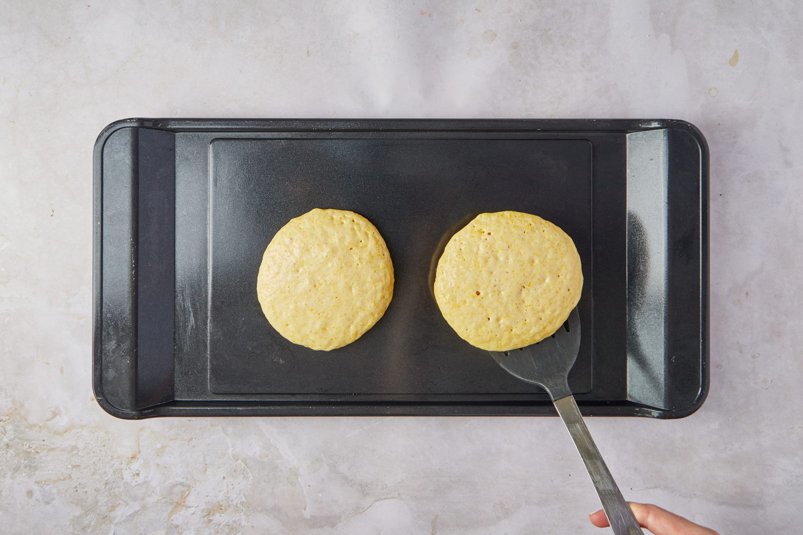 Cook the cornbread pancakes on a griddle.