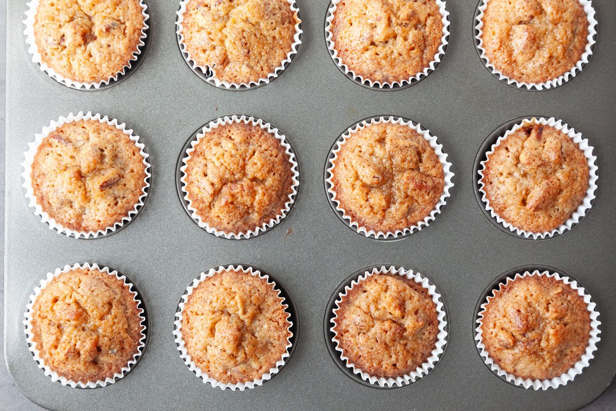 Taste of Home Pecan Pie Muffins in a mini muffin tin, right after baking