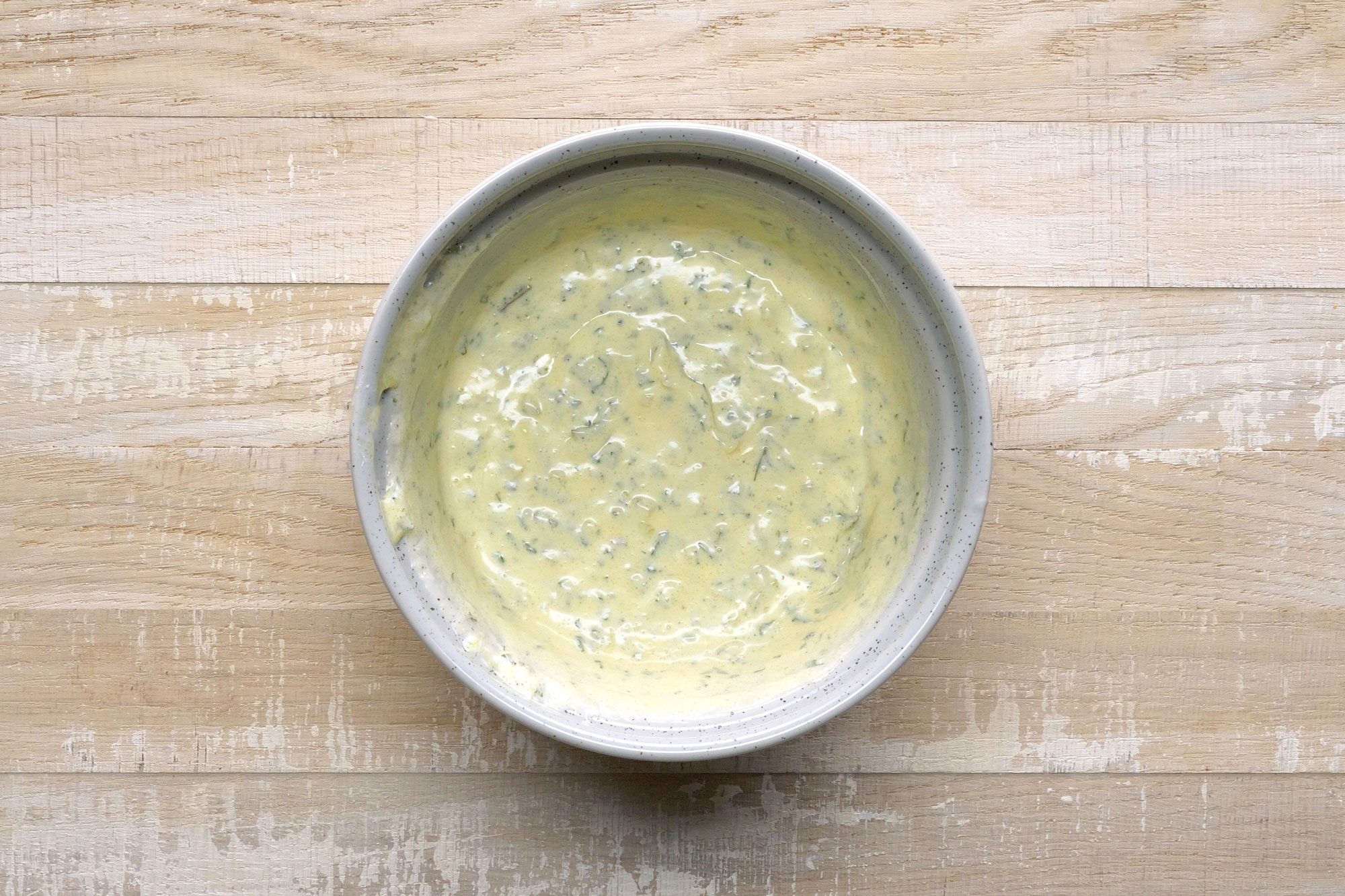 overhead shot; wooden background; Mixture for Red Potato Salad