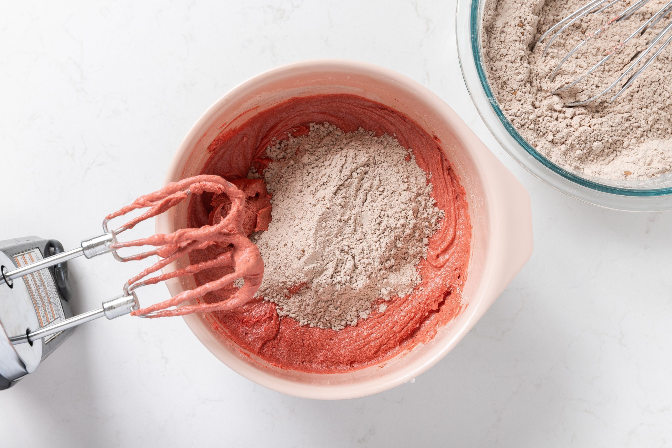 Dry ingredients being incorporated to wet ingredients mixture.