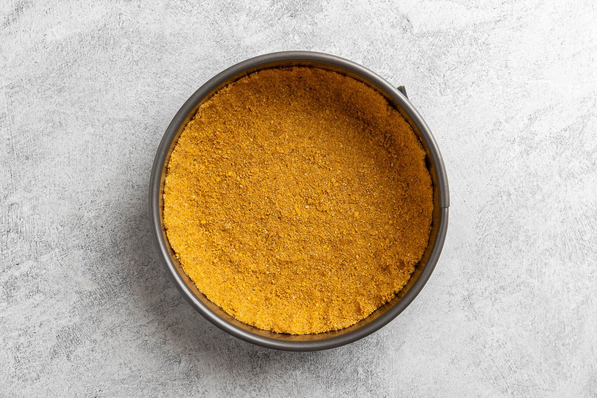 Taste of Home Ricotta Cheesecake recipe photo the prepared crust pressed into a springform pan.