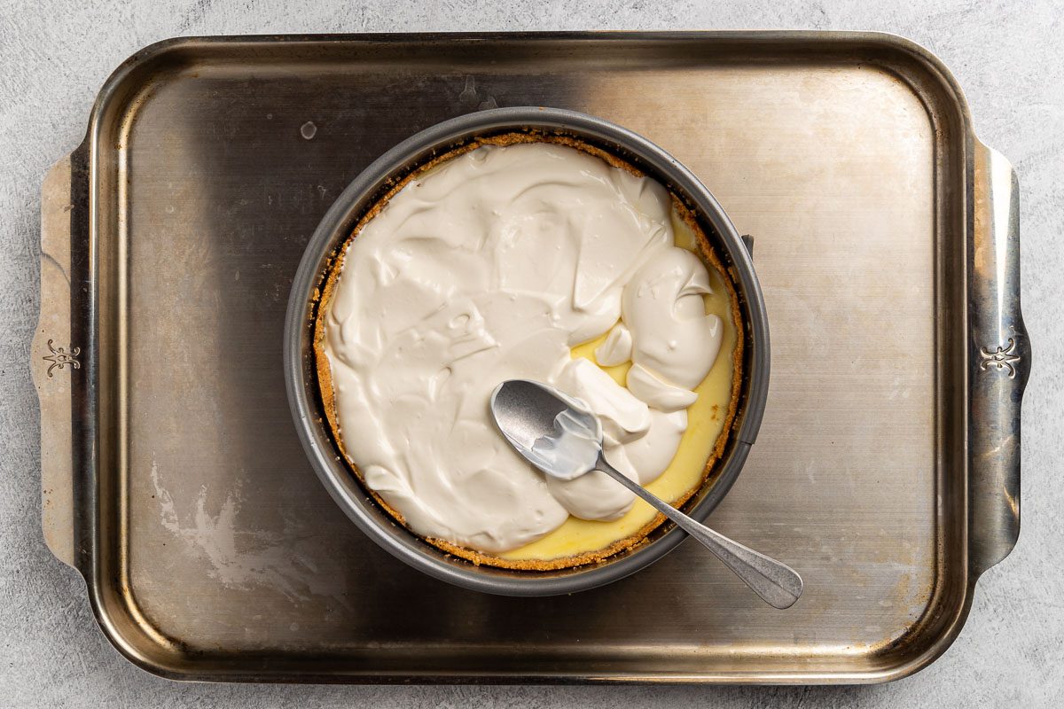 Taste of Home Ricotta Cheesecake recipe photo of the sour cream topping spread over the filling.