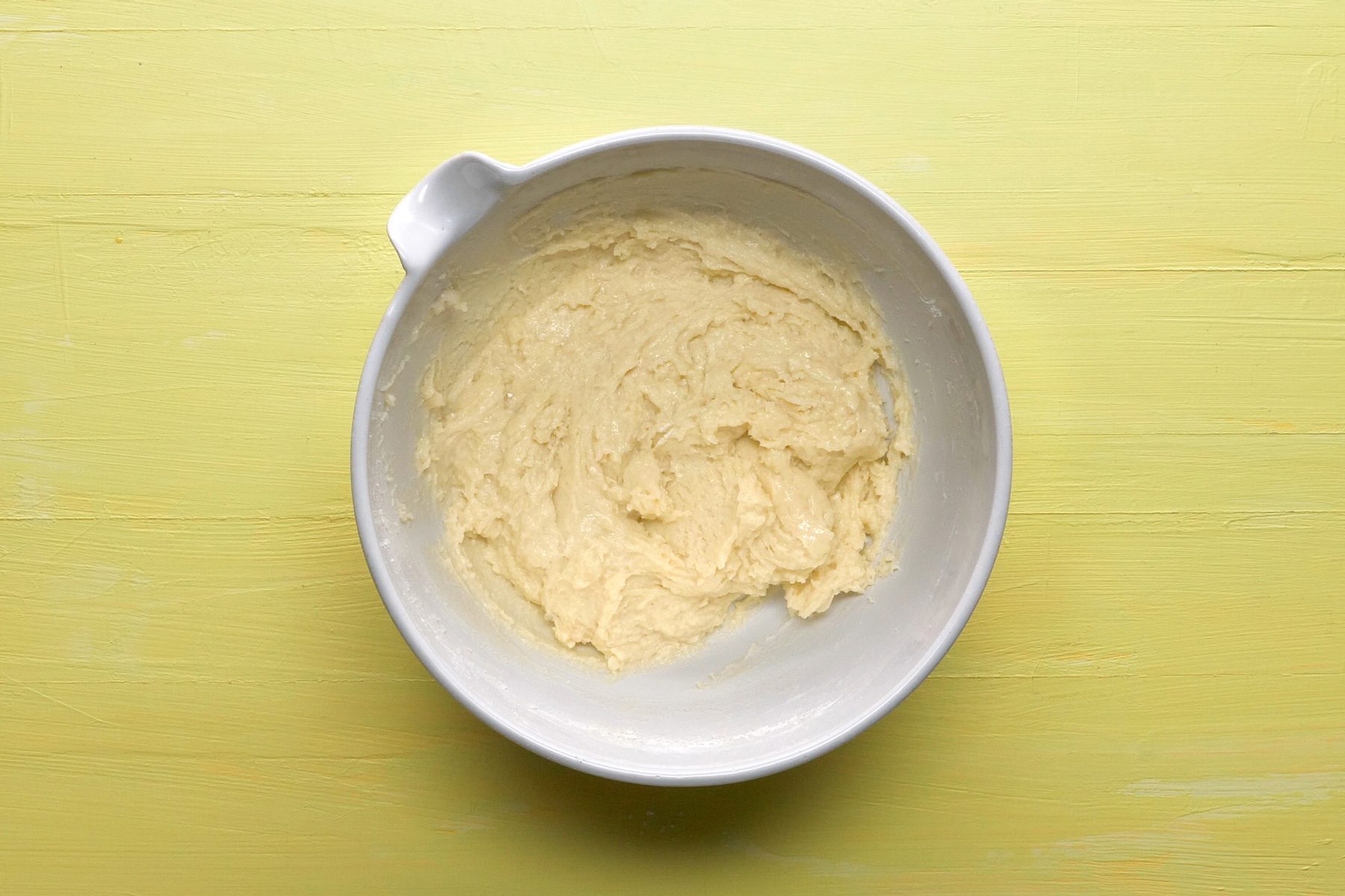 Top view shot of whisked eggs in a bowl