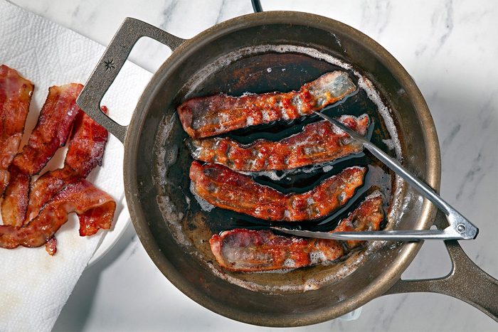 overhead shot; In a large skillet, cook bacon over medium heat until crisp