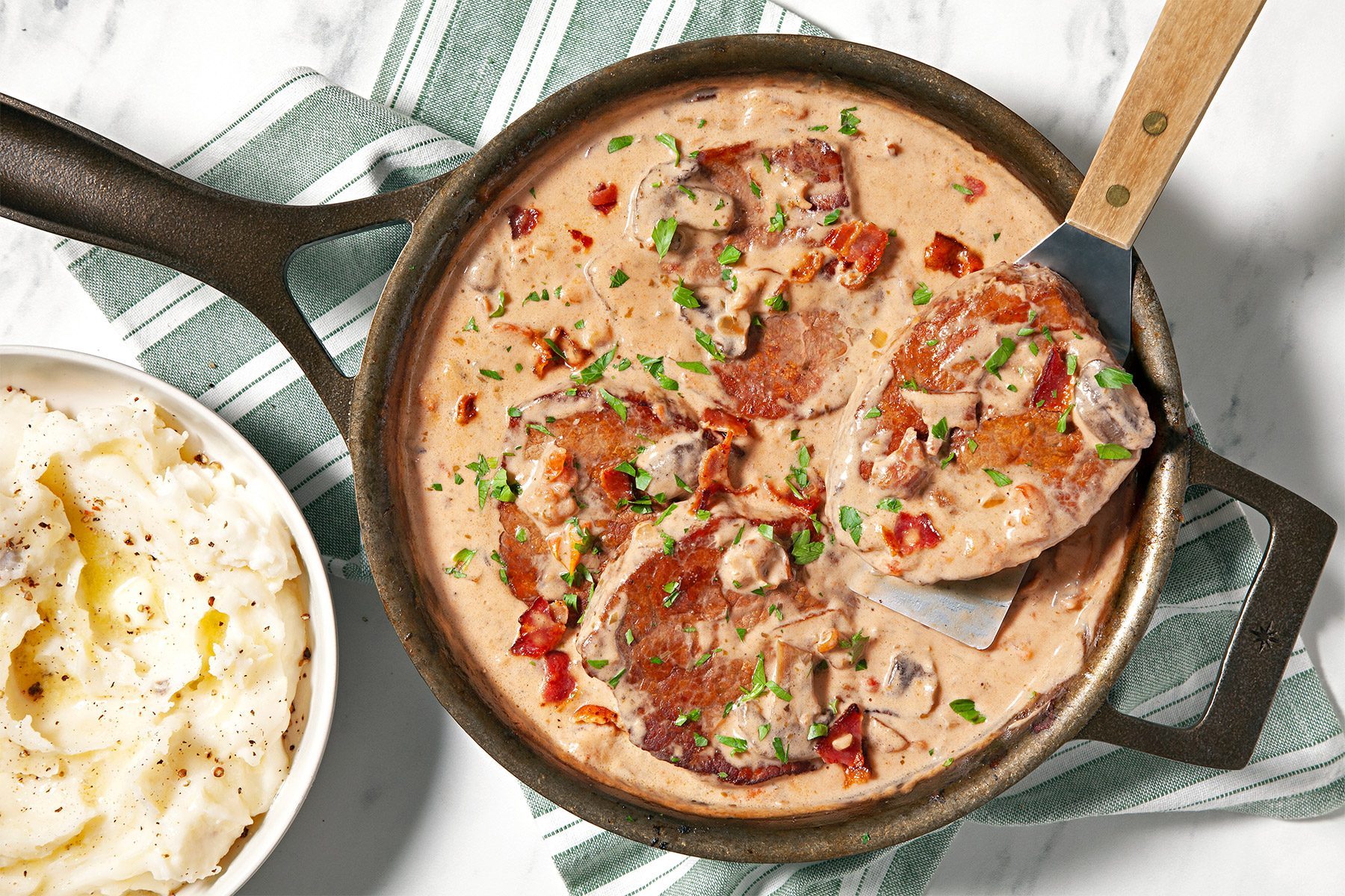 overhead shot of oven swiss steak garnished with fresh parsley