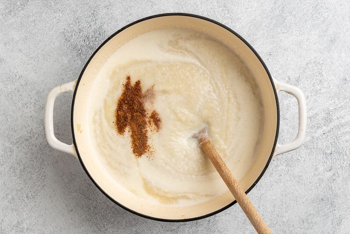 Taste of Home Turnip Soup recipe photo of the pureed soup with half and half and ground nutmeg added to the pot.