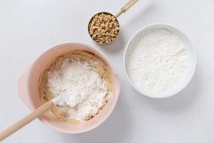 Ingredients for dough being mixed in bowl.