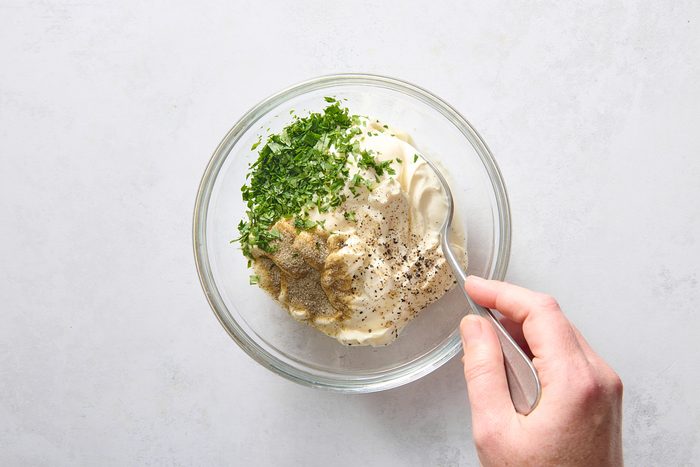 Staring dip ingredients together in a small bowl