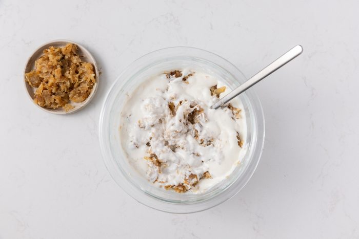 Onions and dip mixture combined in mixng bowl.