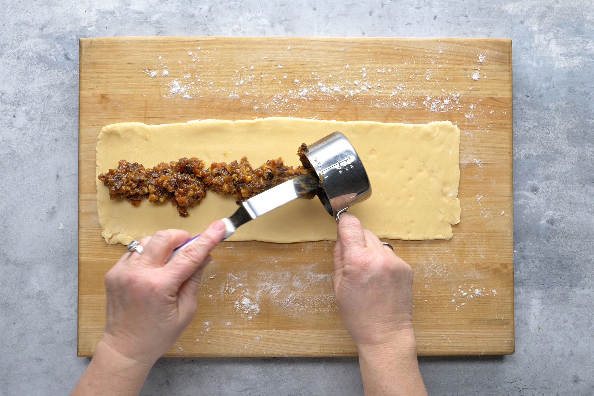 Spread 1 cup filling lengthwise down center of each rectangle