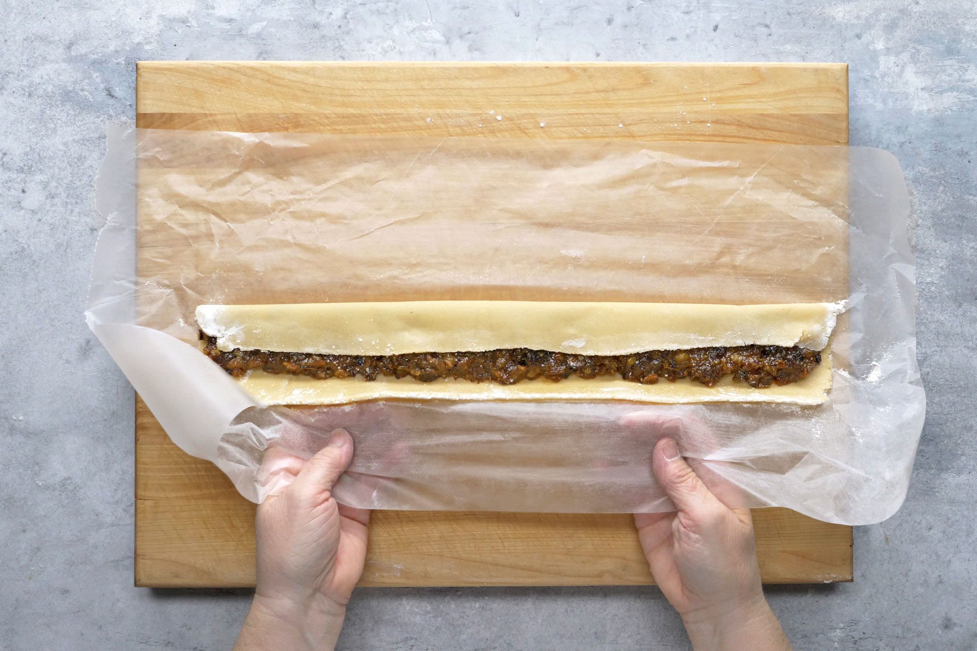 Roll out each portion between 2 sheets of waxed paper rectangle. Spread 1 cup filling lengthwise down center of each rectangle