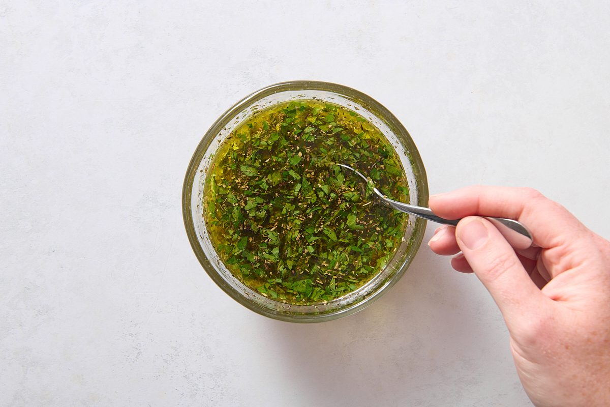 Stirring marinade ingredients in a bowl