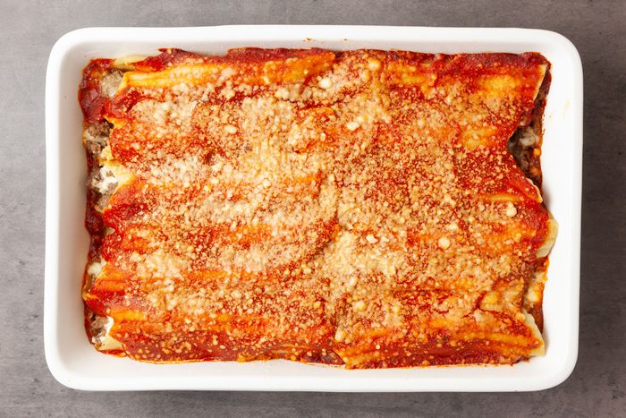 Step 6 of Taste of Home Meaty Manicotti is to cover and bake the manicotti for 40 minutes. Uncover the pan, and bake for 5 to 10 minutes longer, or until the top is bubbly and heated through.