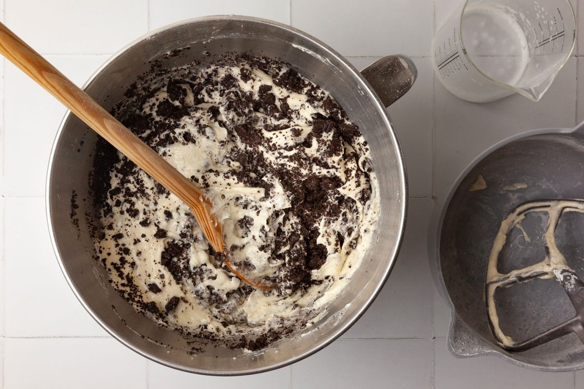 Step 2 of Taste of Home Oreo Cupcakes is to whisk together the flour, baking powder and salt. Add the dry ingredients to the creamed ingredients, alternating with the milk and beating well after each addition. Finally, fold in the crushed Oreos.