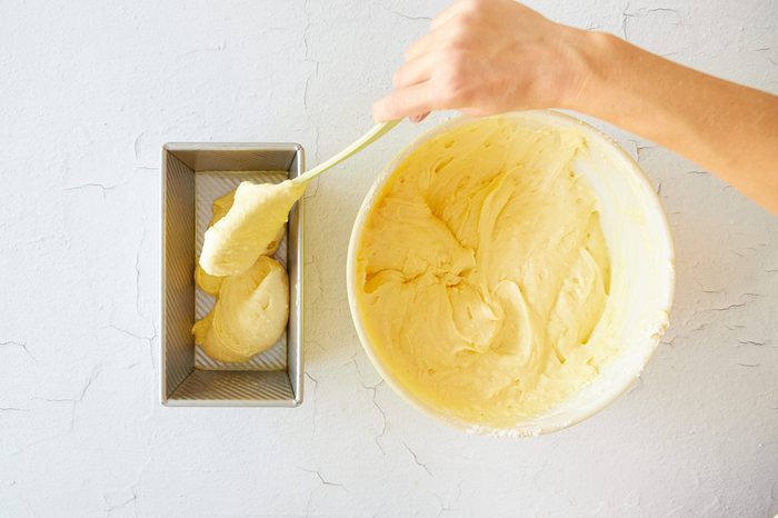 Add the whipping cream pound cake batter to the prepared pans