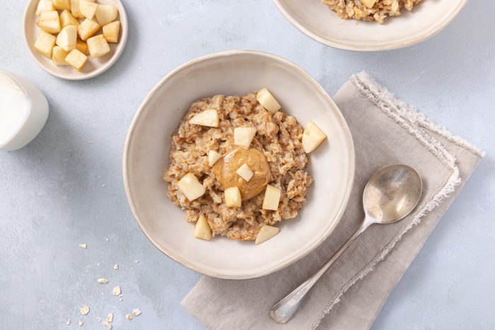 Peanut butter oatmeal served in bowls.