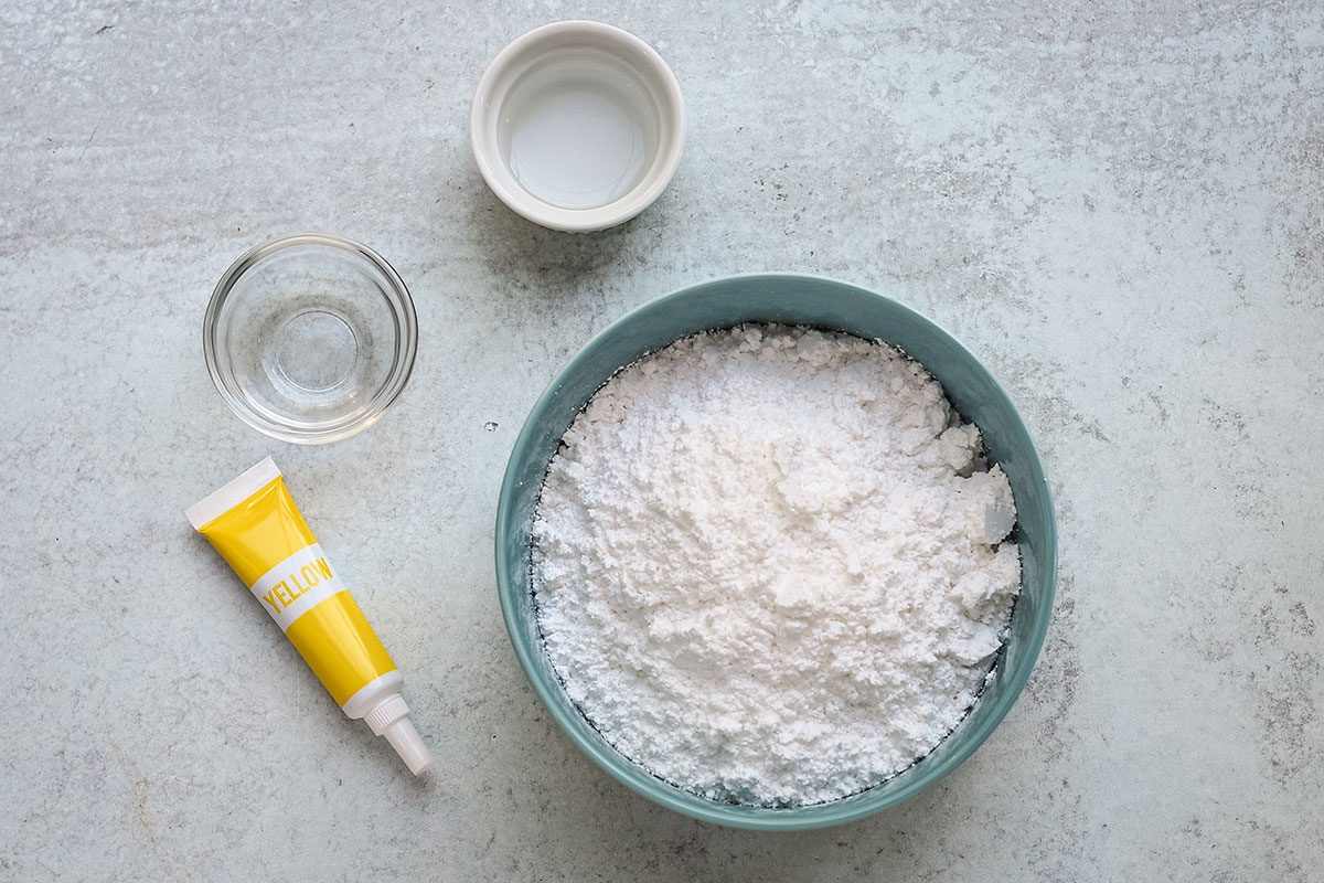 Ingredients for a powdered sugar glaze from Taste of Home, including confectioners sugar, food coloring, and vanilla.