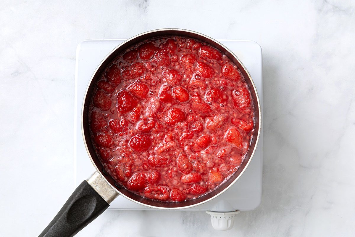 Raspberries in water cooked in medium heat with lemon juice, sugar and cornstarch for step one of Raspberry Coffee Cake recipe for Taste of Home