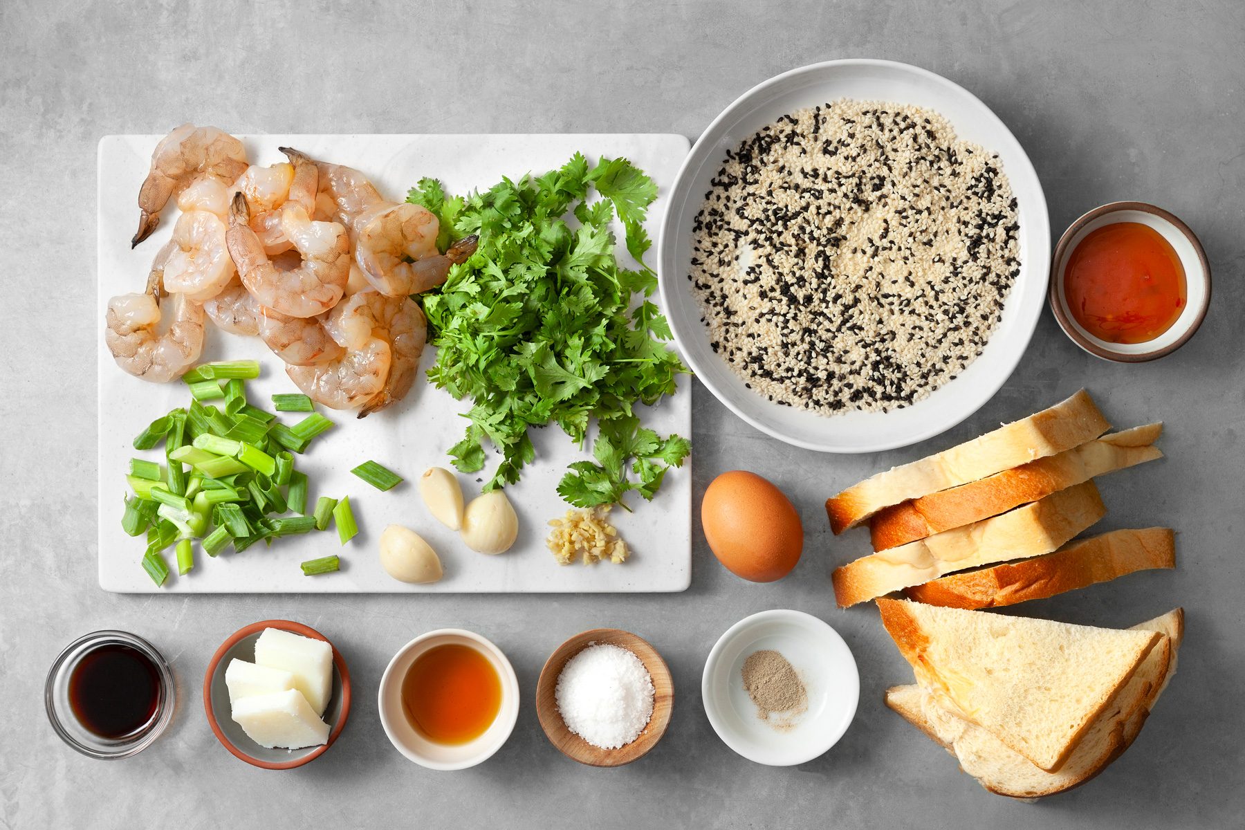 overhead shot; light grey background; Shrimp Toast ingredients placed over background;