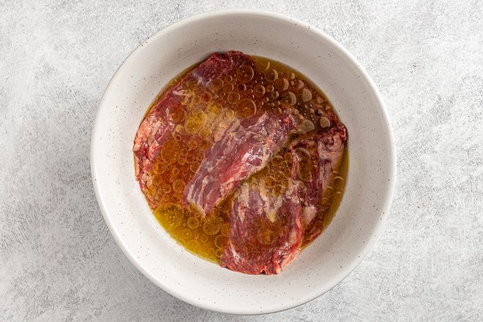 Taste of Home Skirt Steak Tacos recipe photo of marinating the steak.