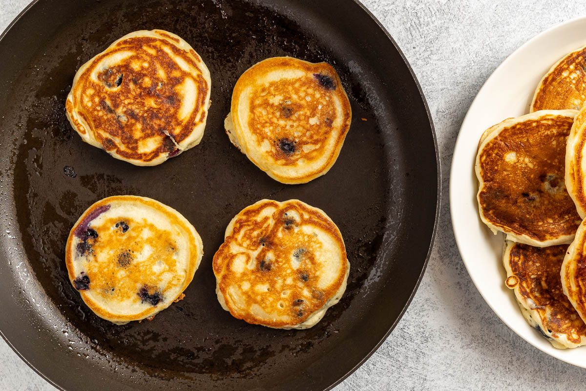 Taste of Home Small Batch Pancakes recipe photo of cooking the pancakes in a skillet.