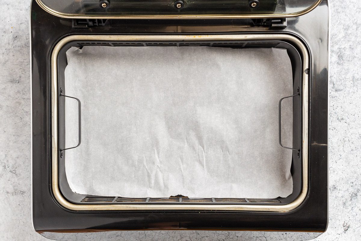 Taste of Home Air Fryer Apple Fritters photo of preparing the air fryer basket.