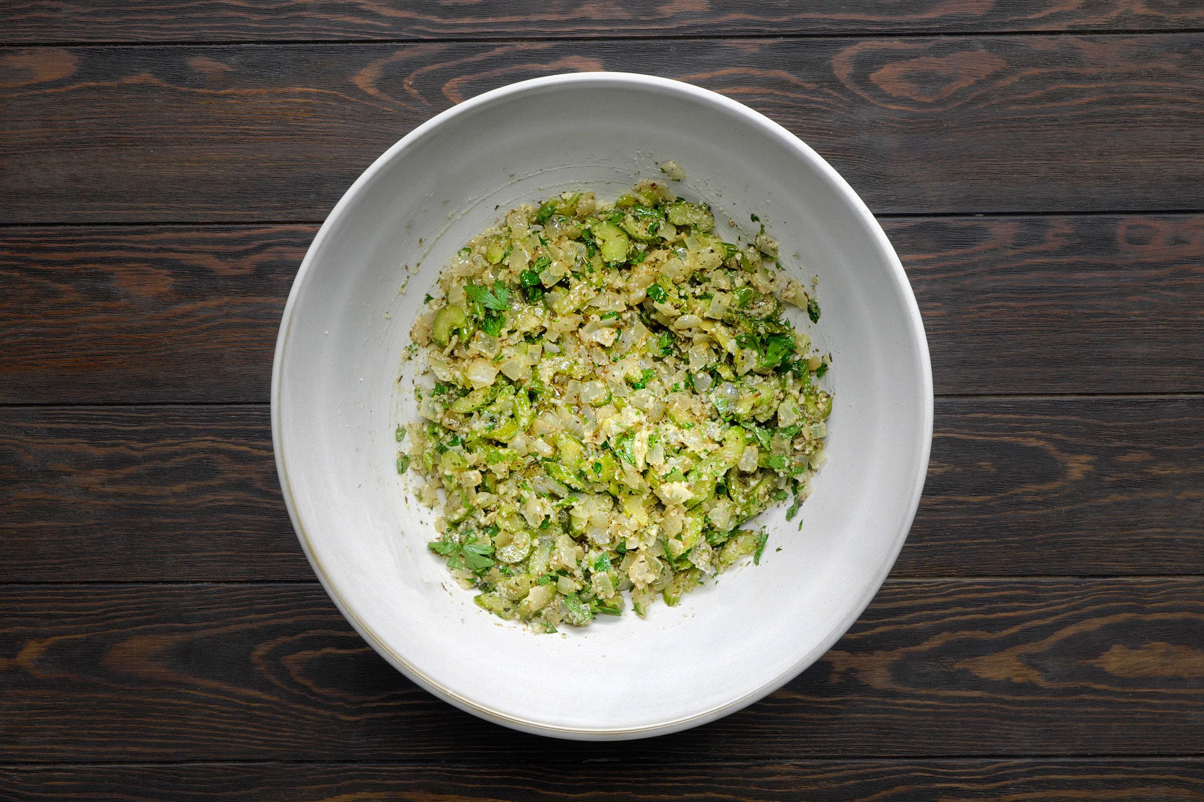 Saute celery, onions, sage and thyme in butter mixed with cheese, parsley, salt and pepper