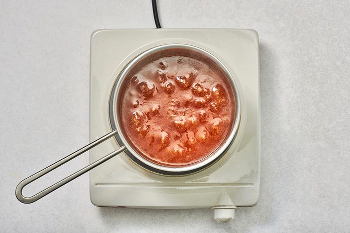 The syrup becomes bubbly and starts to thicken