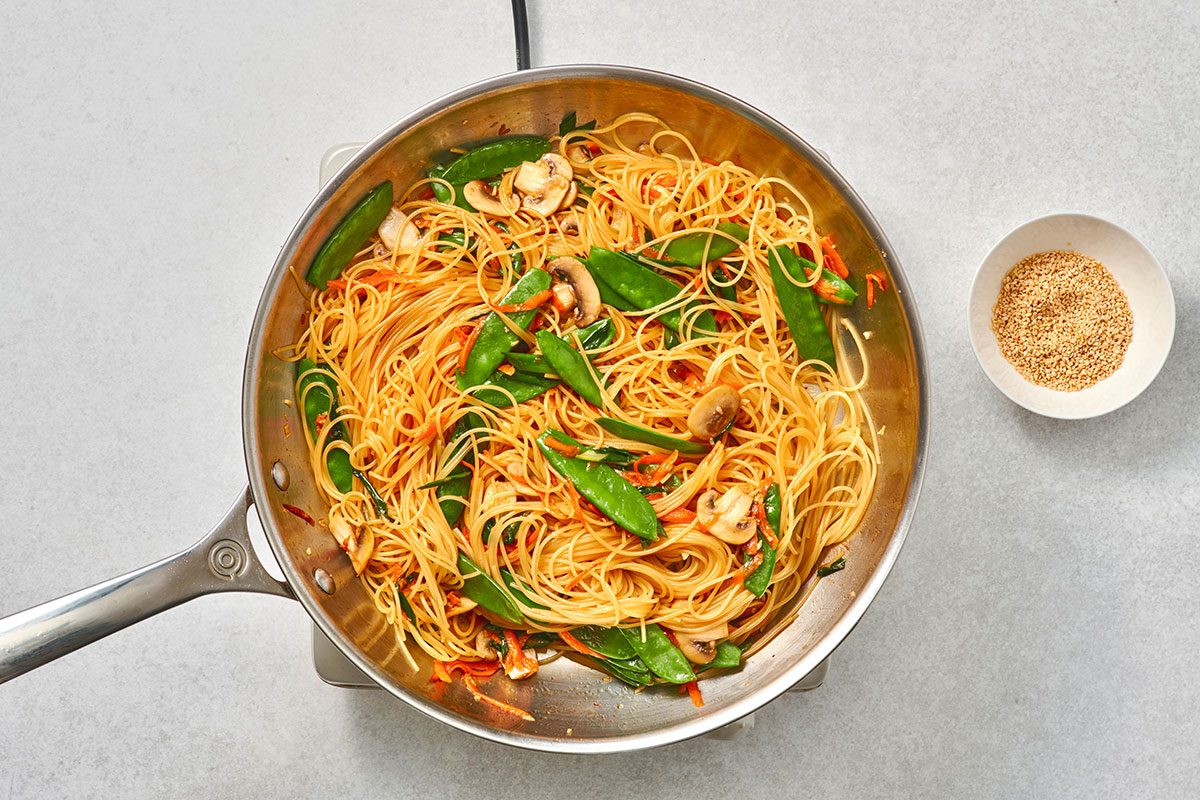 Pasta and soy sauce added to the skillet and tossed with vegetables until well coated. 