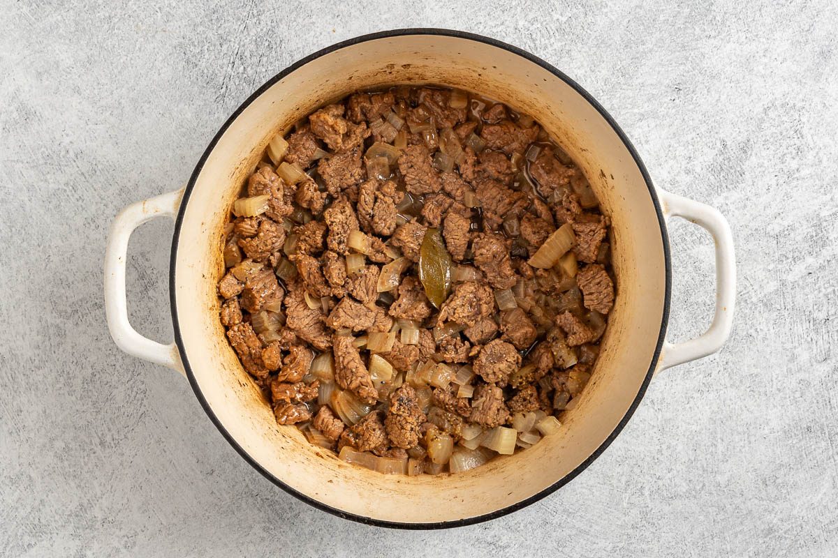 browning beef and adding onion, pepper, salt and a bay leaf.
