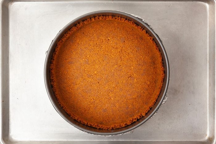 Step 1 of Taste of Home Biscoff Cheesecake is to prepare the crust