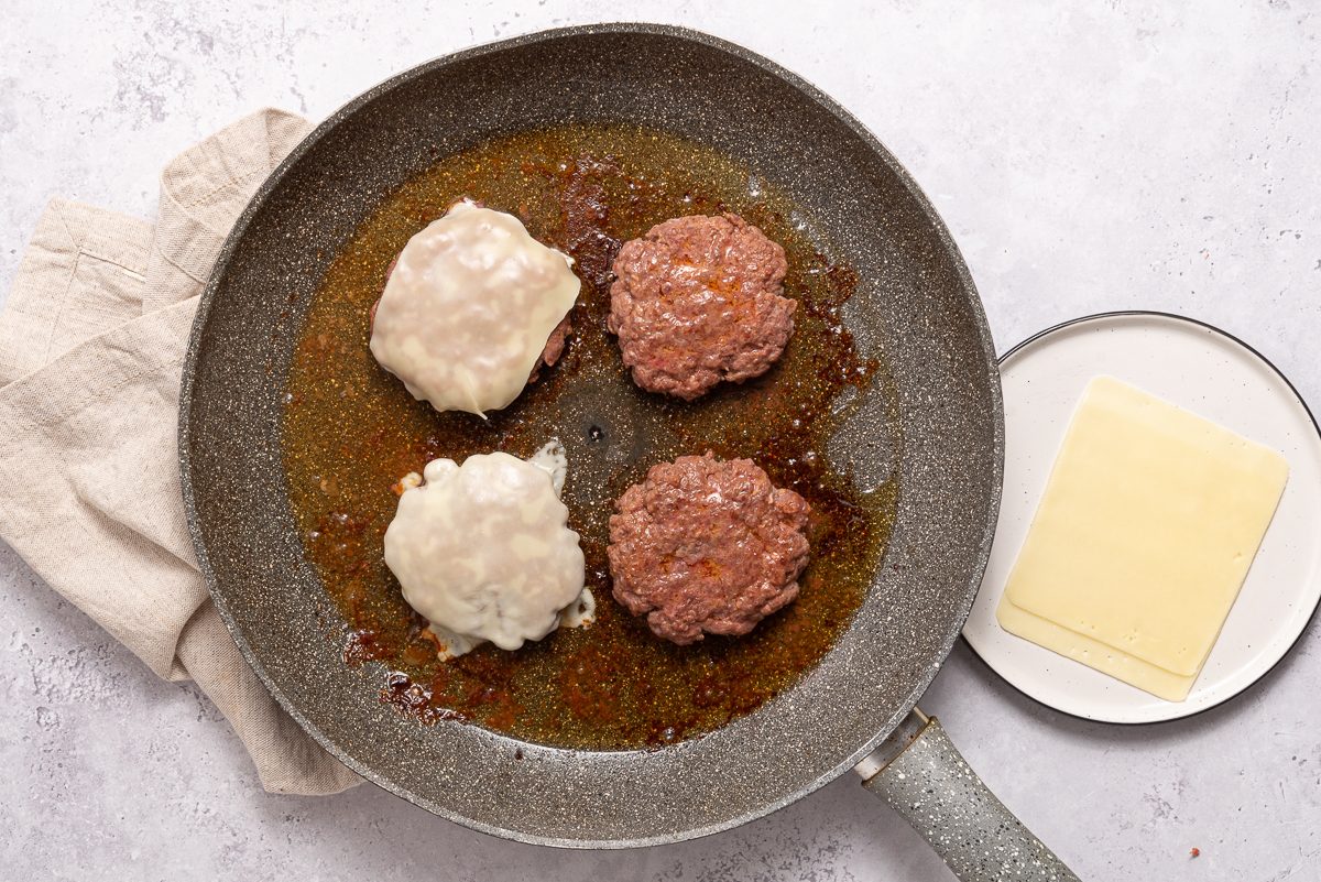 Cooked Bison Burgers With Swiss Cheese