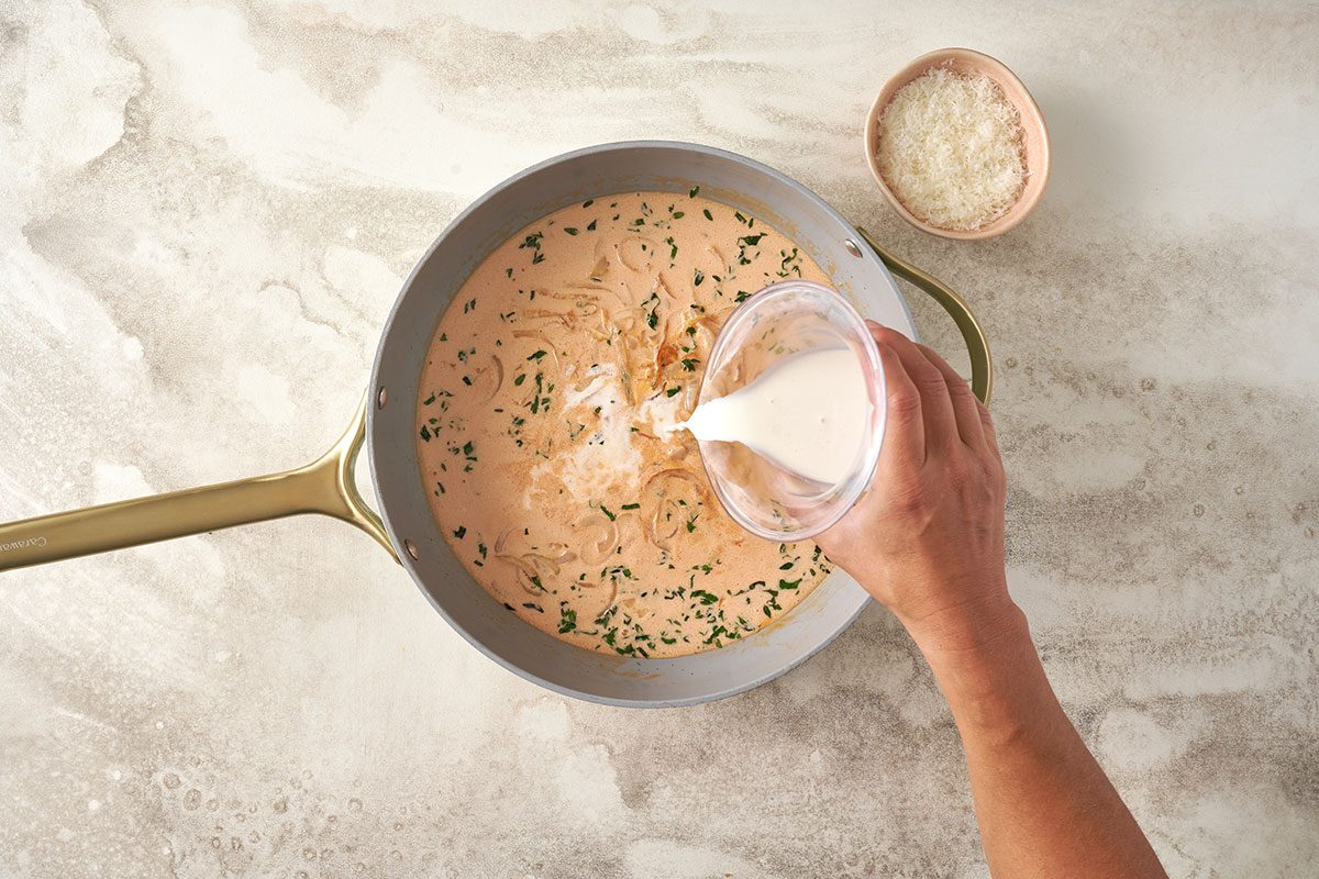 Whisk flour and cream together, then stir into the sauce until it thickens. Add 1/4 cup of cheese to finish the creamy sauce for the Creamy Pasta by Taste of Home. 