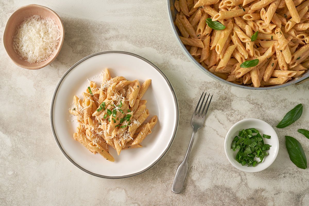A full view of the Creamy Pasta, topped with freshly grated cheese and served hot with the rich cream sauce