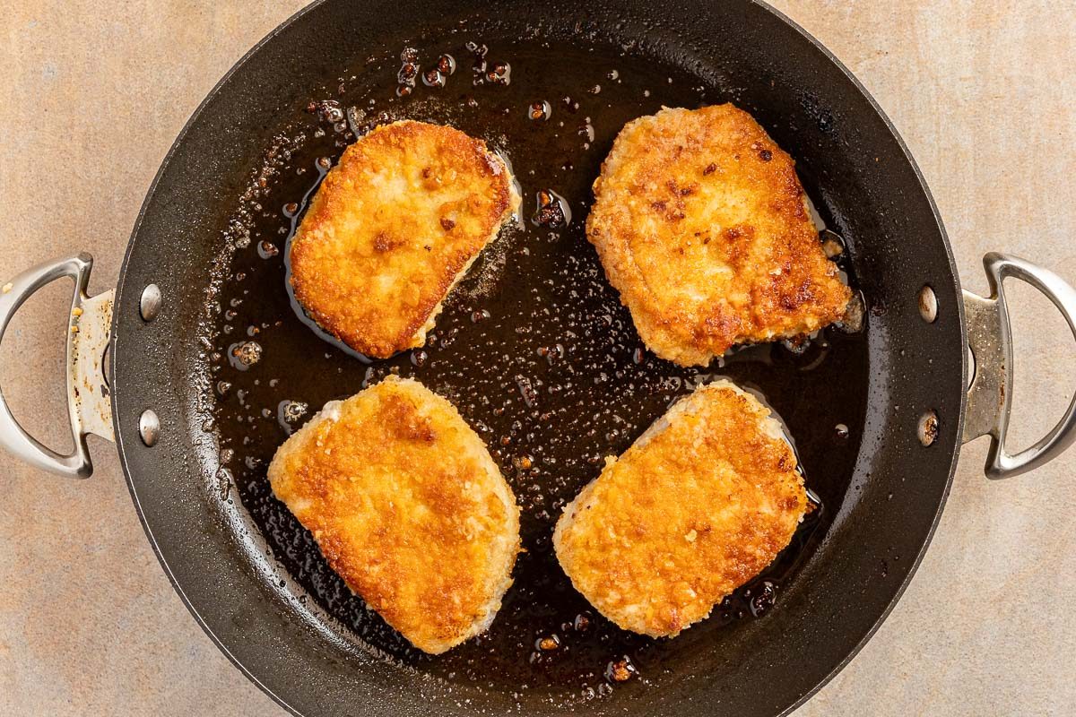 cooking the breaded pork chops