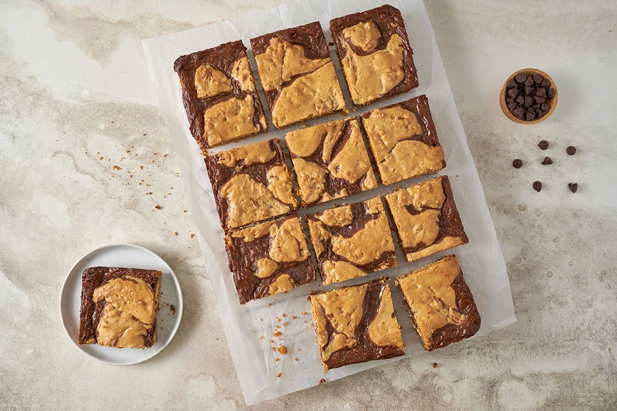 Taste of Home Cake Mix Bars: Finished Cake Mix Bars, topped with melted chocolate howcasing their rich texture and layered look.