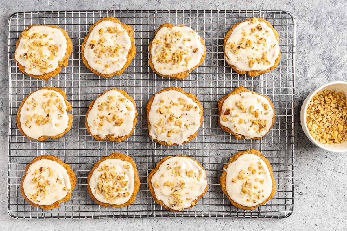 Taste of Home Carrot Cake Cookies photo of the frosted cookies topped with walnuts.